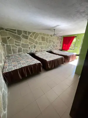 Cama o camas de una habitación en Hotel Villa Aventura
