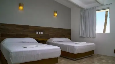 Cama o camas de una habitación en Hotel Villa Mexicana Puerto Escondido