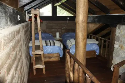 Cama o camas de una habitación en Cabañas La Tierra Grande
