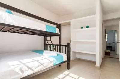 Cama o camas de una habitación en Nuevo en Booking Casa Acapulco Diamante a Pasos de la Playa
