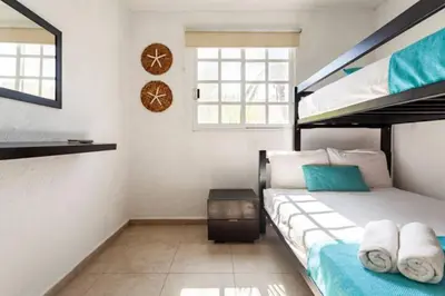 Cama o camas de una habitación en Nuevo en Booking Casa Acapulco Diamante a Pasos de la Playa