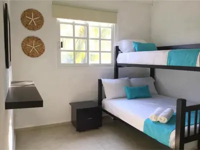 Cama o camas de una habitación en Nuevo en Booking Casa Acapulco Diamante a Pasos de la Playa