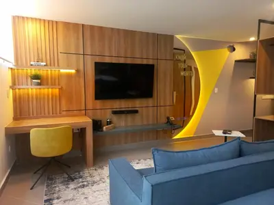 Una televisión o centro de entretenimiento en Missum Versatile Living