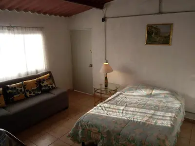 Cama o camas de una habitación en Casa de Irma para visitar la ciudad o de negocios