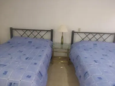 Cama o camas de una habitación en Casa de Irma para visitar la ciudad o de negocios
