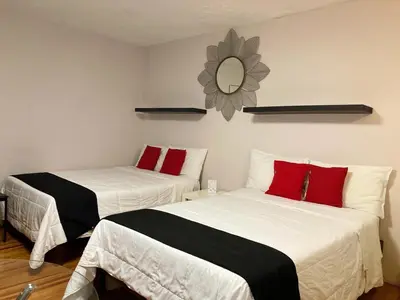 Cama o camas de una habitación en Suites Viveros Coyoacán I Hospedaje a tu medida
