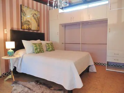 Cama o camas de una habitación en Suites Viveros Coyoacán I Hospedaje a tu medida