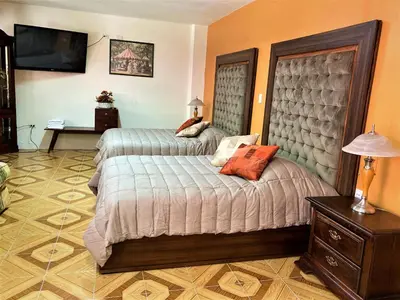 Cama o camas de una habitación en VILLA D-SPITIA Apartamentos en renta