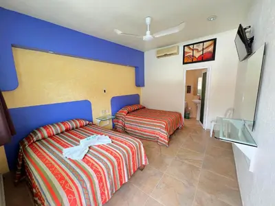 Cama o camas de una habitación en Hotel Xestalito