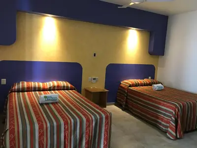 Cama o camas de una habitación en Hotel Xestalito