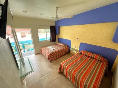 Cama o camas de una habitación en Hotel Xestalito
