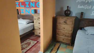 Cama o camas de una habitación en Chuchumbé Hotel & Hostal