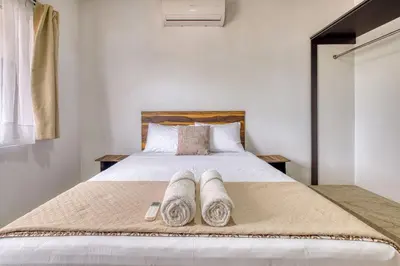 Cama o camas de una habitación en La Aurora Puerto Escondido