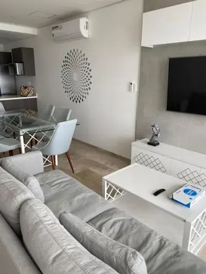 Una televisión o centro de entretenimiento en Apartamento Le Club Acapulco