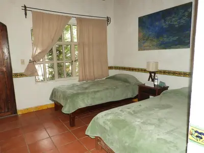Cama o camas de una habitación en Santuario Jardín de la Abundancia
