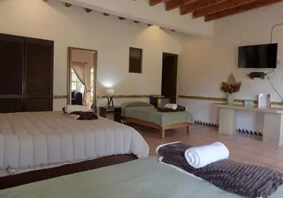 Cama o camas de una habitación en Santuario Jardín de la Abundancia