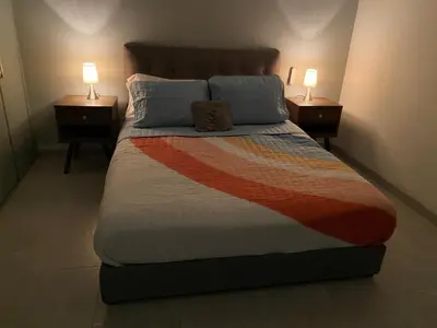 Cama o camas de una habitación en Casa de las Palmeras Lomas de Cocoyoc