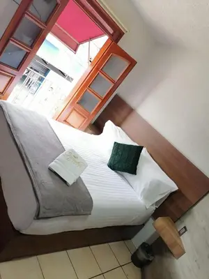 Cama o camas de una habitación en Hotel Orquídea