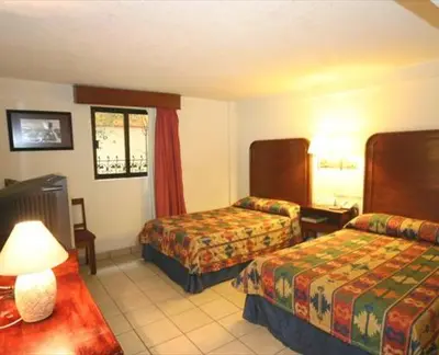 Cama o camas de una habitación en Hotel Calenda