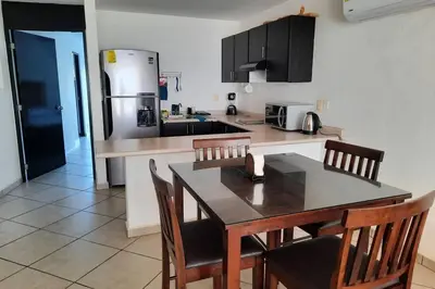 Una cocina o zona de cocina en Departamento 105 , paraiso del pacifico