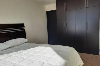 Cama o camas de una habitación en Departamento 105 , paraiso del pacifico