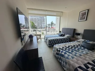 Cama o camas de una habitación en ACAPULCO aura009