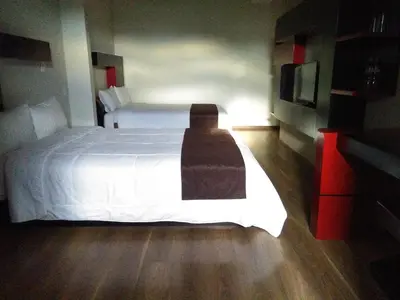 Cama o camas de una habitación en Hotel Cancalli Tlaxcala