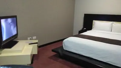 Una televisión o centro de entretenimiento en Hotel Cancalli Tlaxcala