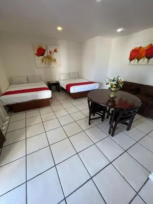 Cama o camas de una habitación en Hotel Arcos Aeropuerto