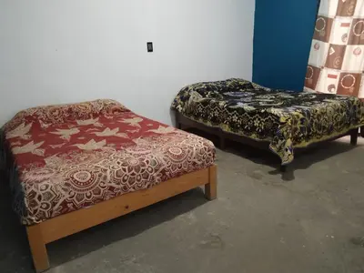 Cama o camas de una habitación en Aquetzali Kin Casa Privada con alberca