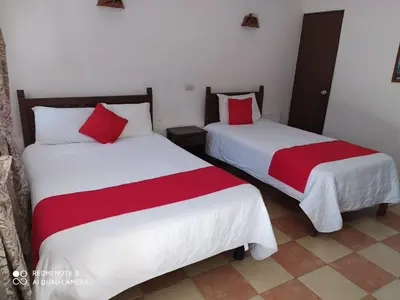 Cama o camas de una habitación en Hotel Montecarlo