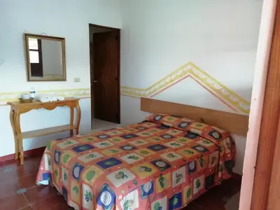 Cama o camas de una habitación en Posada Los Naranjos