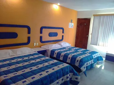 Cama o camas de una habitación en Posada San José, Hotel