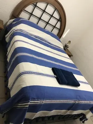 Cama o camas de una habitación en Departamento la crucecita, con aire acondicionado, excelente ubicación, en segunda planta
