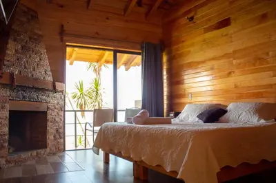 Cama o camas de una habitación en San José del Pacífico- Cabañas Camino al Cielo 5