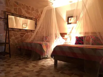 Cama o camas de una habitación en Hotel Posada Rancho Los Laureles