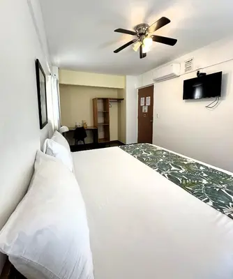 Cama o camas de una habitación en Hostal Tres Central