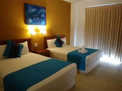 Cama o camas de una habitación en Hotel Arenas del Pacifico