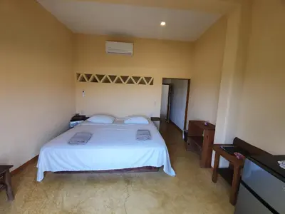 Cama o camas de una habitación en LUNA DE MIEL con aire acondicionado
