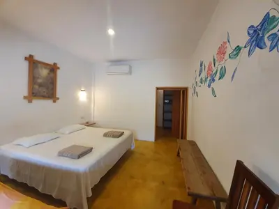 Cama o camas de una habitación en LUNA DE MIEL con aire acondicionado
