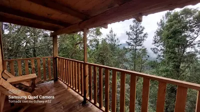 Un balcón o terraza de Cabaña en el Bosque de San José del Pacífico