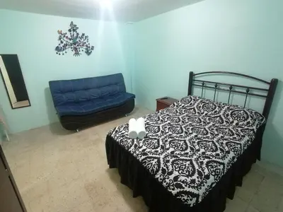 Cama o camas de una habitación en DEPARTAMENTO CERCANO AL AEROPUERTO T2, A 2 CALLES