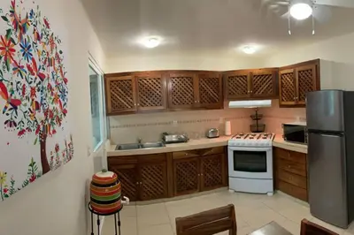 Una cocina o zona de cocina en El Colorín, a condo in the heart of Huatulco