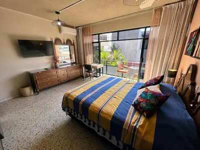 Cama o camas de una habitación en Casa de las Palmas Guest House