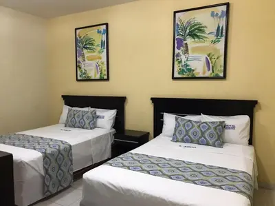 Cama o camas de una habitación en Hotel Dorado a una calle de Playa Regatas y el Malecon