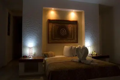 Cama o camas de una habitación en HOTEL VILLAS XAIBA