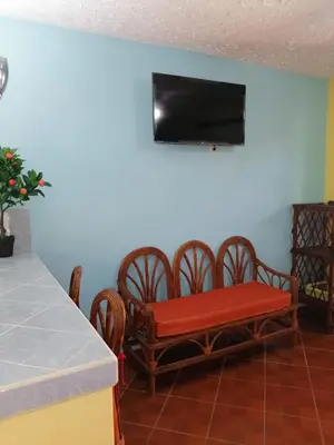 Una televisión o centro de entretenimiento en Villas La Bella Margarita