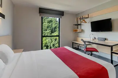 Cama o camas de una habitación en City Express by Marriott Oaxaca