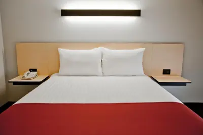 Cama o camas de una habitación en City Express by Marriott Oaxaca