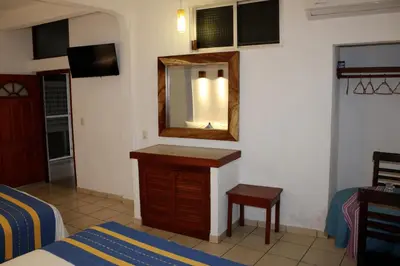 Cama o camas de una habitación en Hotel Careyes Puerto Escondido